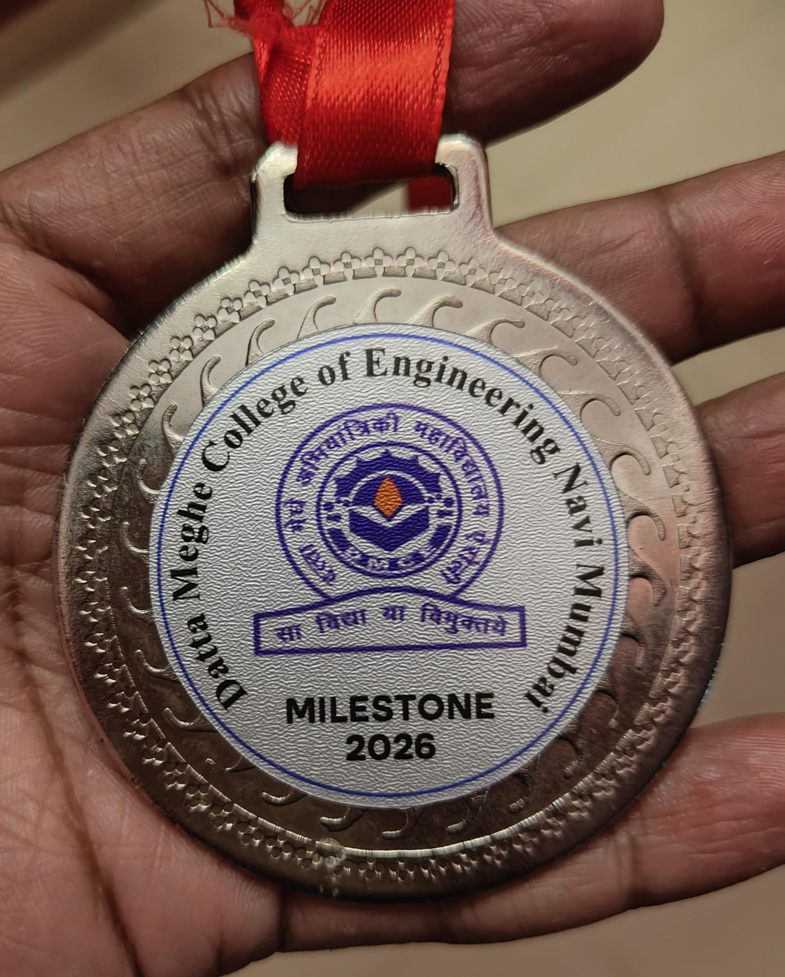 Best Goal Scorer medal from the college football tournament
