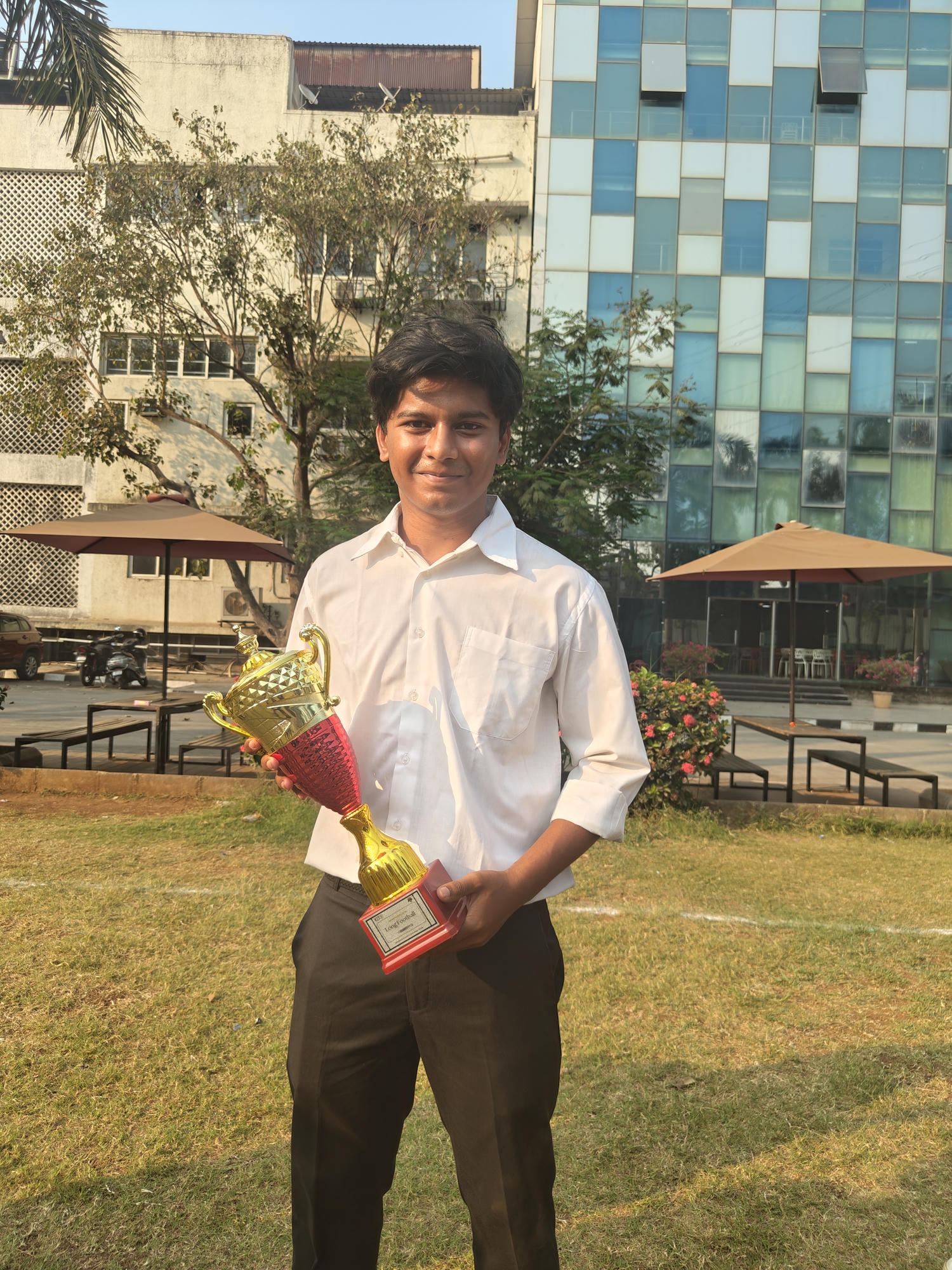 Soham holding a trophy after the Sportsmania ’26 football runner-up finish